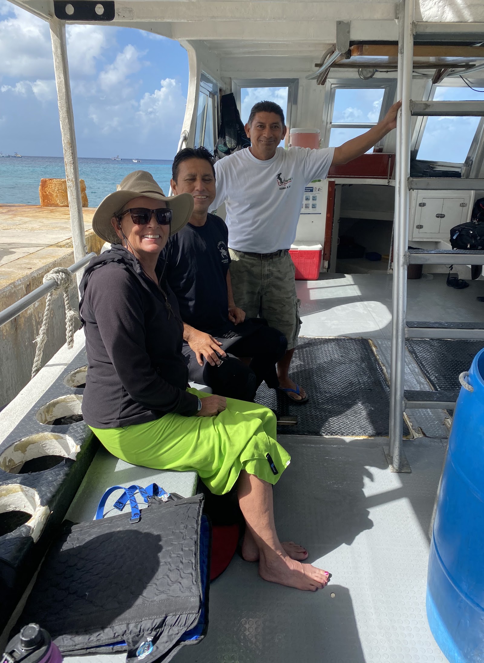 Careyitos crew members on the back deck of the boat in Cozumel